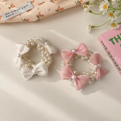 China An early vintage bow pearl hair band hairband female elastic spring band tied the hair high sense of the fairy simple hair accessories for sale