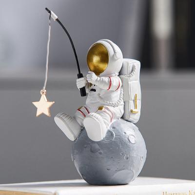 China Nordic Creative New China Resin Astronaut Sculpture Figurine Home Decoration Accessories Home Birthday Gift Modern Craft Shop Office Store for sale