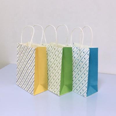 China Creative Reused Mini Door Gift Paper Bag Gift Shop Custom Simple Paper Name Bag Materials Gift Bag for sale