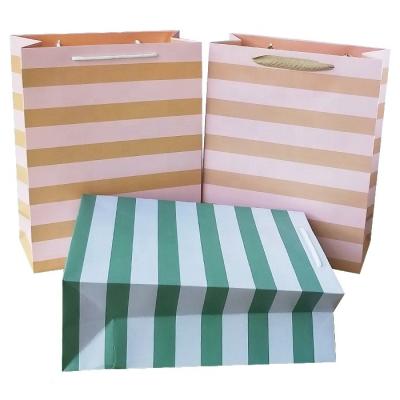 China Recyclable Custom Design White Card Fancy Shopping Paper Bag Printing Custom Paper Gift Wrapping Apparel Packaging Bag for sale