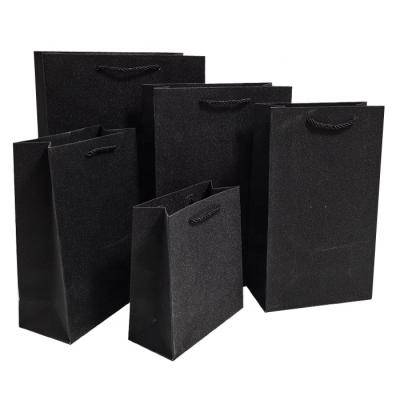 China Recyclable Custom Paper Clothing Tote Bags Candy Packaging Bags Wedding Gift Bags for sale