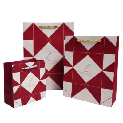 China Recyclable Custom Clothing Tote Bags Candy Snacks Paper Paper Packaging Bags Incorporated Business Gift Bags for sale