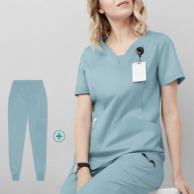 China Gently 2022 New Fashion Design Women Nurse Fashion Medical Scrub Uniform Top With Side Panels Unisex Trendy Scrub Sets for sale