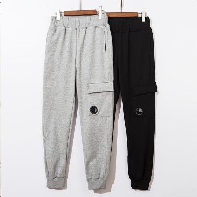 China Anti-wrinkle CP brand cotton casual pants for men women loose drawstring pocket sport pants for sale