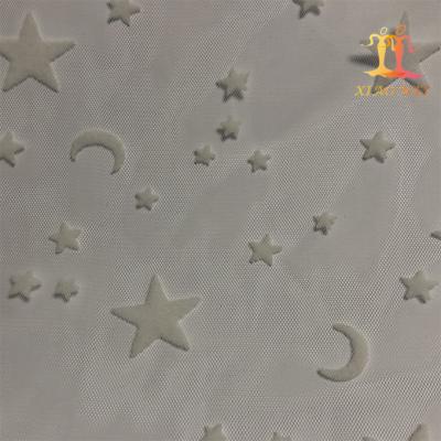 China New Style Sustainable 100% Polyester Flocking Stars And Moon Pattern Tulle Lace Fabric For Skirt for sale