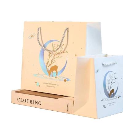 China Recyclable Wholesale Empty Gift Packaging Bags Kraft Paper Black Mark Carry Bag for sale