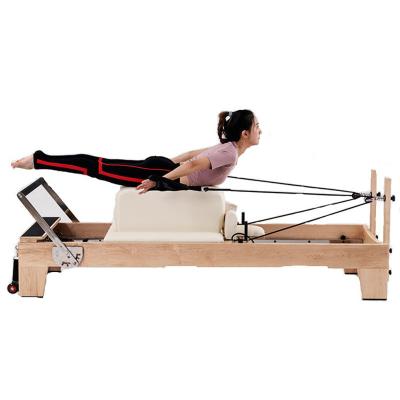 China Wunda Home Pilates Chair Equipment Maple Wood Pilates Reformer Bed Machine Fitness Equipment Pro Yoga Center Gym Body Building for sale