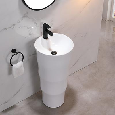 China Modern Wholesale Popular Vanity Sleek One Piece White Ceramic Pedestal Sink for sale