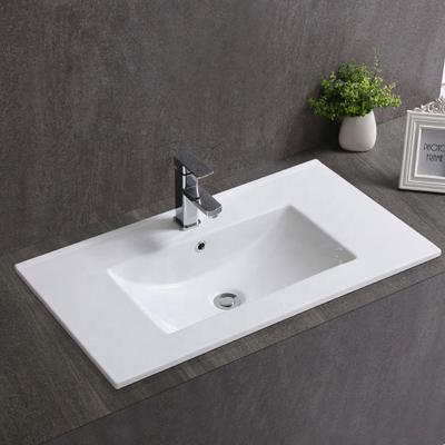 China Modern Simple Ceramic Cabinet Sink Cheap Hotel Hotel Vanity Hole Wash Basin for sale