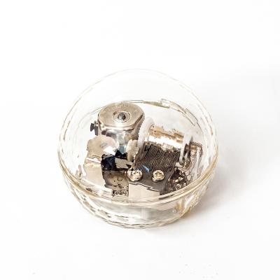 China Custom Crystal Transparent Gold Round Acrylic Wind-Up Music Box for sale