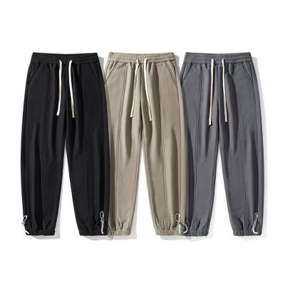 China 2023 hot sale custom anti-pilling polyester fleece knit elastic drawstring fitness men's waist casual pants with strap design for sale