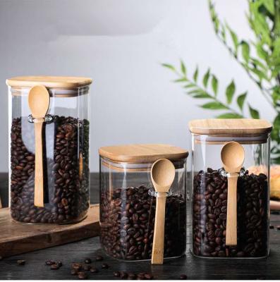 China 2022 Viable Customizable 800/1000/1200ml Spice Coffee Beans Nuts New Tall Bottles Tea Bucket Glass Bottle Jar With Lid And Bamboo Spoon for sale