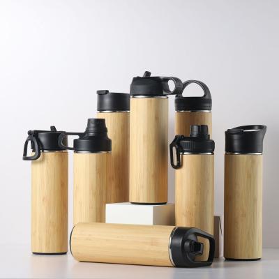 China Stainless Steel Sustainable Double Wall Thermos Bamboo Vacuum Water Bottle Flasks With All Kinds Of Lid for sale