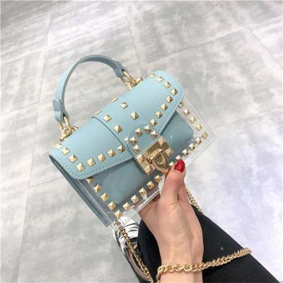 China Fashion Multifunctional Cheap Price Chain Bags Women Handbags Ladies Transparent Jelly Clear Bag With Rivets for sale