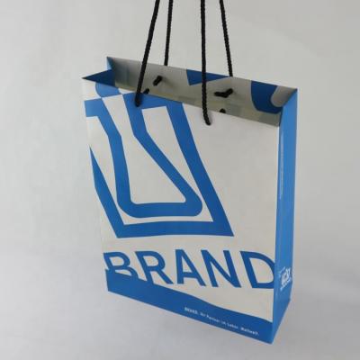 China Recyclable Stone Paper Gift Bag With Matte Lamination for sale