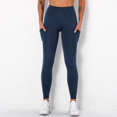 China Antibacterial Striped Pockets Hip Yoga Pants Running Fitness Yoga Suit Sports Legging Nine Point Exercise Pants For Women for sale