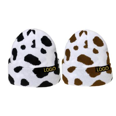 China JOINT Wholesale Custom Color And Logo Fold Up Winter Knit Cow Animal Print Beanie Hats for sale