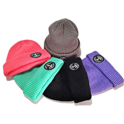 China JOINT Custom Woven Patch Knit Cuff Fold Up Blank Acrylic Unisex Waffle Beanie Hat Skull Cap for sale