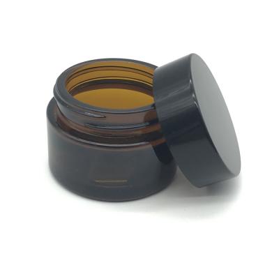 China Personal Care 30g Amber / Empty Brown Luxury Cosmetic Glass Face Jars For Cream With Black Plastic Cap for sale