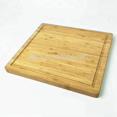 China Sustainable original bamboo made with juice groove cutting board kitchen chopper with juice groove for meat cheese and vegetable for sale