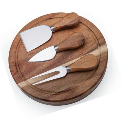 China Viable set of 4pcs round shape acacia wood cheese box with cheese board cheese knife and knife set made of acacia wood for sale