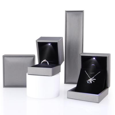 China 2023 recyclable new design led light jewelry packaging box led jewelry ring box led lights leather jewelry ring boxes with logo for sale