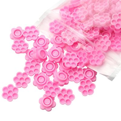 China Mink / Silk Eyelash Extensions Plastic Flower Shaped Lashes Pad Dye Glue Holder Adhesive Glue Tray for sale