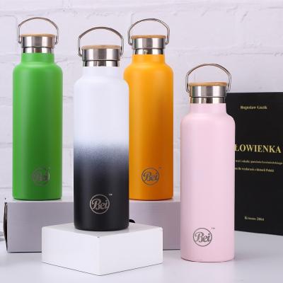 China 700ml Double Wall Stainless Steel Sustainable Vacuum Insulated Sport Water Bottle With Bamboo Lid for sale