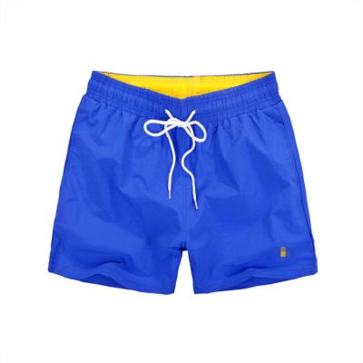 China 2021 QUICK-DRY men's shorts color shorts breathable and comfortable new summer pocket beach net quick-drying men's shorts for sale