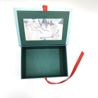 China Recycled Materials Custom Luxury Blue Magnet Flap Paper Box Flip Top Gift Boxes With Red Ribbon Closure for sale