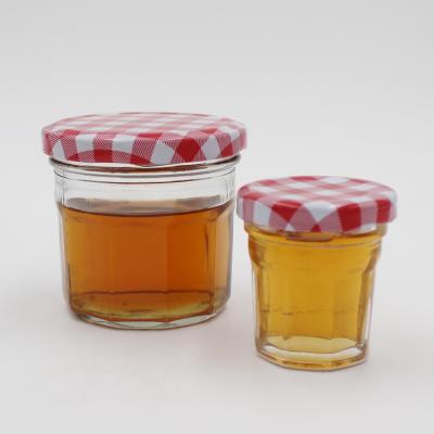 中国 100ml food glass honey jars with metal lid, jam jars glass packaging with metal lid for sale 販売のため