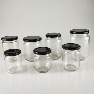 中国 Empty canned food tomato jam food jars, 20 oz glass material food grade thermo jar with metal cap for wholesale 販売のため