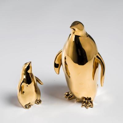 China Custom ceramic gold animal abstract figurine garden statue table penguin home decor minimalist ceramic decoration for sale