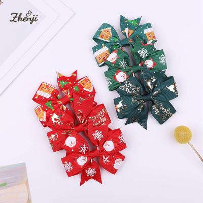 China New Babies Hair Accessories Christmas Sweet Snowman Printed Hair Bows Hair Clips Girls Holiday Hairpin 2470 for sale