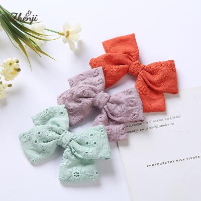 China Soft Hollow Embroidery Cotton Bow Hair Clips For Girls Cloth Kids Hair Pins for sale