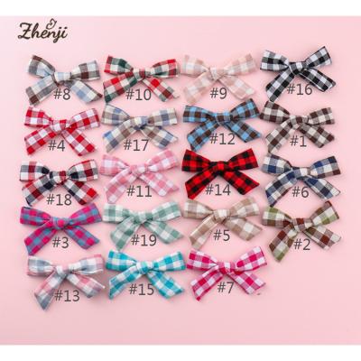 China Multi-color children's plaid bow children's hair clips hair clips children's style sweet Korean baby hair accessories for sale