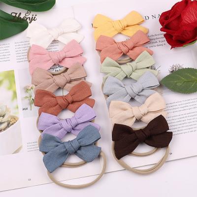 China Korean Style Candy Color Headbands Hair Accessories 2310 Children Bowknot Hair Band Super Soft Nylon Baby Infant Soft Headband for sale