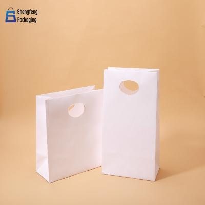 China High quality low price color Kraft paper bag customized printed tape handle Kraft paper bag for sale