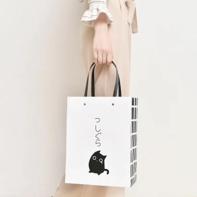 China Black and white stripe paper bag made by kraft paper for sale