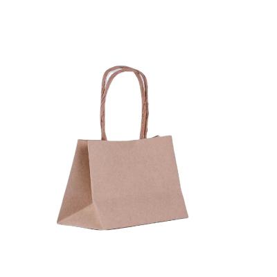 China Wholesale Stock Brown Kraft Paper Shopping Packaging Bag With Handle for sale