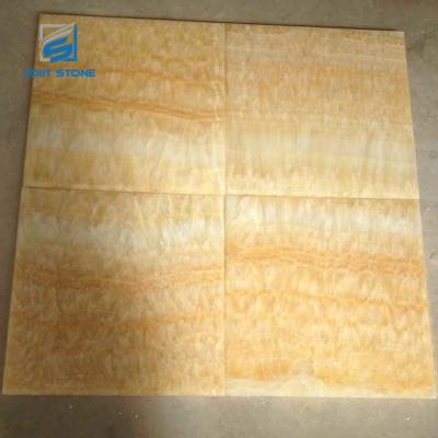 China Match Modern Natural Translucent Yellow Onyx Stone Book Stone Tiles for sale