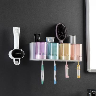 China New Sustainable Bathroom Eco Toothpaste Dispenser Automatic Toothbrush Holder for sale