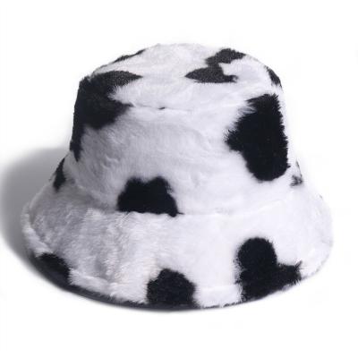 China COMMON black and white autumn and winter plush cow pattern fisherman hat to keep the output CIA basin warm buying wild hat for sale