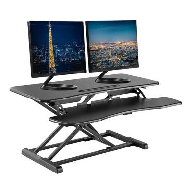 China Hot Modern Amazon Height Adjustable Foldable Computer Desk Workstation Keyboard Table Standing Keyboard Table Shock Absorber Sit and Stand Desk for sale