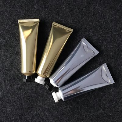 China Skin Care Cosmetics Wholesale Small Squeeze Lotion Tubes Container Plastic Shiny Plastic Cosmetics Storage Soft Hose 50G Tube for sale