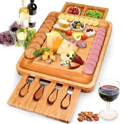 China Sustainable Hot Wooden Serving Tray Amazon Bamboo Cheese Board Set With Cutlery In Slide Out Drawer Cheese Tray Cutting Board Wholesale for sale