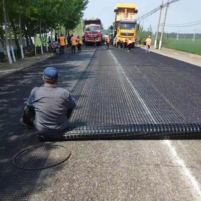 China Industrial 50KN non self adhesive high tensile fiberglass geogrid ground mesh for asphalt road for sale