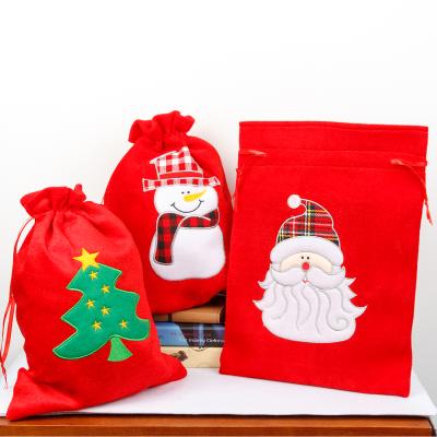 China Christamas Gifts Personalized Red Xmas Twine Embroidery Pleuche Sack Drawstring Christmas Santa Sacks Packaging Bag for sale