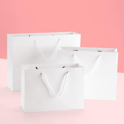 China Disposable Hot Custom Cheap Price Multi-Twist Muti-color Logo Selling Gift Paper Bag for sale