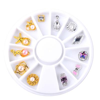 China 12pcs/Box Fashion Gold Silver Bow-knot Flower Ocean Star Design Alloy Nail Decoration 3D Wheel Charm Metal Jewelry Nail Art Accessories for sale